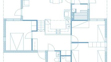 A floor plan with multiple rooms, including a kitchen, dining area, and bedrooms.