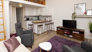 A modern apartment with a kitchen, dining area, and living room. - Koivukuja, katinkullantie by Interhome (Sotkamo)