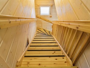 A wooden staircase with a skylight at the top, leading to an upper level. - Villa sofia by Interhome (Sotkamo)