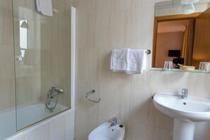 Combined shower/tub, hair dryer, towels, soap