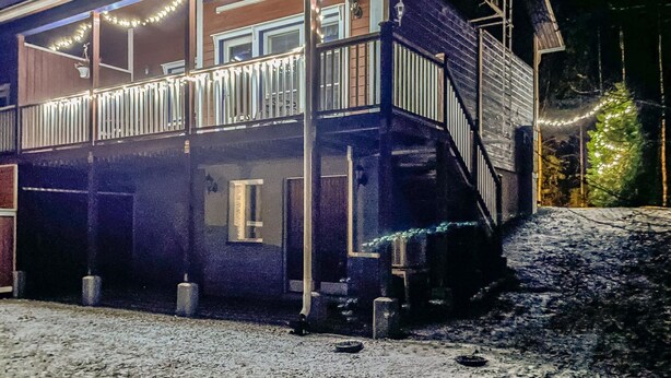 A two-story house with a balcony, a staircase, and a Christmas tree. - Tintintupa by Interhome (Nilsiä)