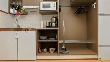 Fridge, microwave, cookware/dishes/utensils