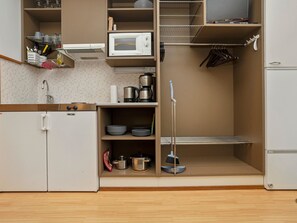 Fridge, microwave, cookware/dishes/utensils