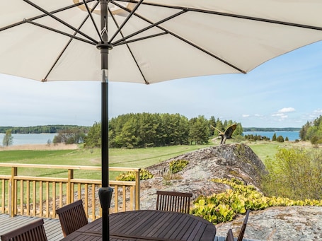Outdoor dining. Villa pääsky by Interhome