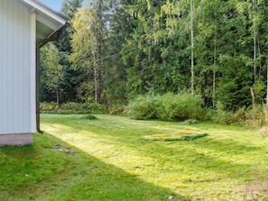 Surrounded by lush trees, this serene property offers a peaceful retreat.