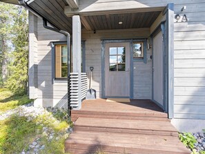 A wooden house with a front door, a porch, and a number '9A' on the wall. - Rukan sarastus by Interhome (Kuusamo)