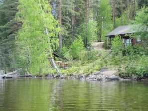 A cabin by a lake surrounded by dense forest. - Illanvirkku by Interhome (Punkaharju)