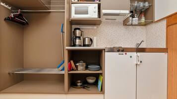 Fridge, microwave, cookware/dishes/utensils