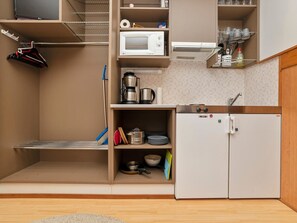 Fridge, microwave, cookware/dishes/utensils