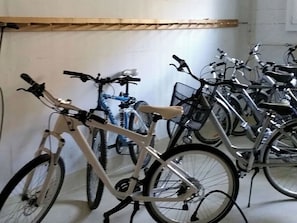 Bicycles parked indoors, possibly in a storage or utility area.