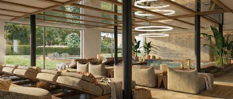 Un área de estar moderna con piscina, asientos cómodos y grandes ventanales con vistas al exterior.