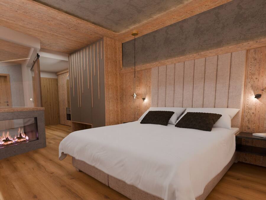 A modern bedroom with a large bed, a fireplace, wooden paneling, and a nightstand.