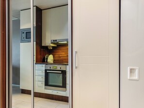 A kitchen with a microwave, oven, and a toaster. - Levi star 2, as. 409 by Interhome (Kittilä)