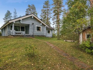 A log cabin with a porch and a small shed. - Harrila by Interhome (Mikkeli)