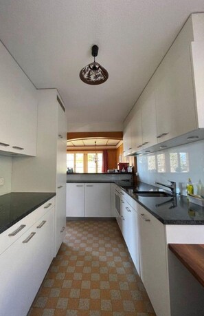 Fridge, dishwasher, highchair, cookware/dishes/utensils