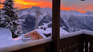 A snowy mountain landscape with a wooden cabin and a tree covered in snow. - Almenrausch 1. OG Süd-Ost by Interhome (Riederalp)