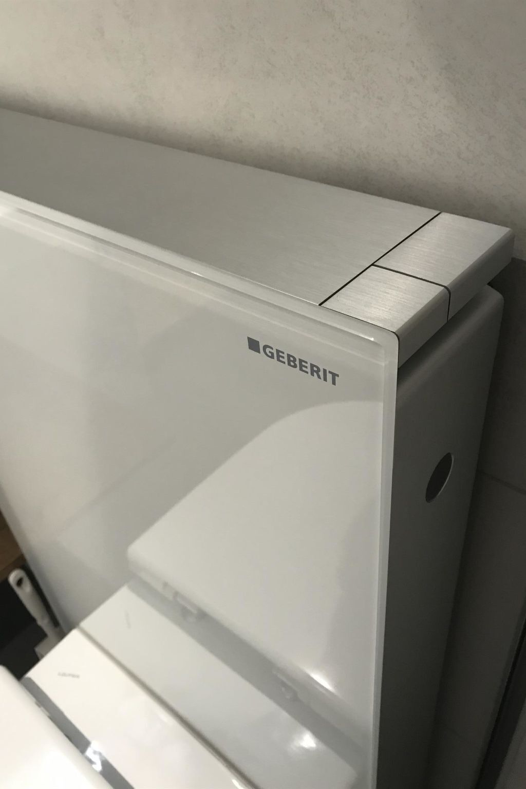 A GEBERIT refrigerator with a metallic top and a white front panel.