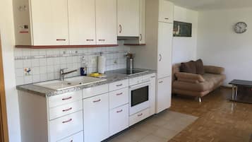 Fridge, microwave, cookware/dishes/utensils, dining tables