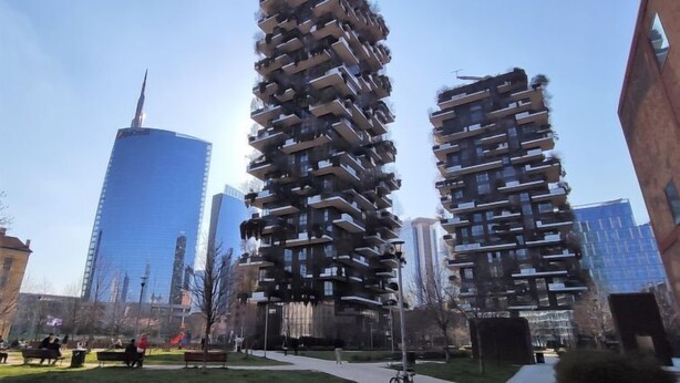 Two high-rise residential buildings with a unique architectural design featuring staggered balconies.