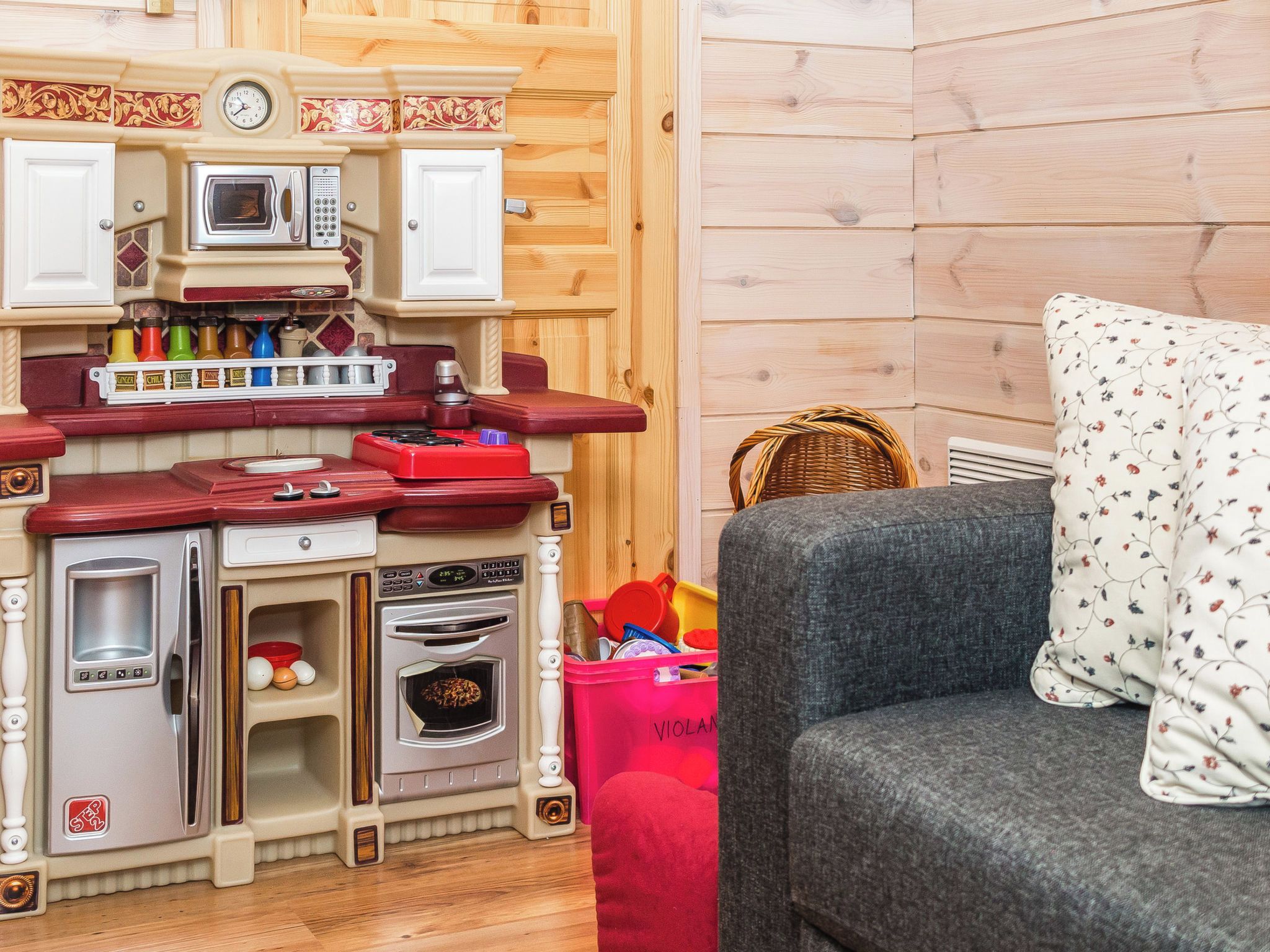A kitchenette with a microwave, oven, and refrigerator.