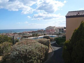 Enjoy a serene coastal retreat with a pool and picturesque views of the sea.