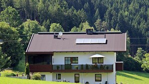 A modern two-story house with a sloped roof, solar panels, and a balcony. - Apartment Fabian by Interhome (Kaltenbach)