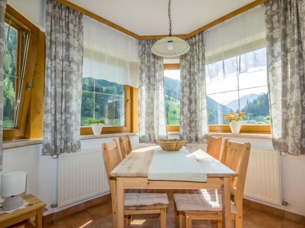 Enjoy meals in this dining area with a view of the surrounding mountains.
