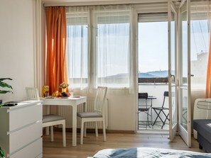 Enjoy a functional and comfortable stay in this well-appointed room featuring a desk, dining area, and cozy seating options.