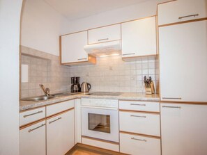 Fridge, microwave, oven, cookware/dishes/utensils