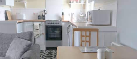 Fridge, microwave, oven, cookware/dishes/utensils