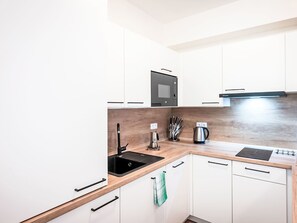 Fridge, microwave, cookware/dishes/utensils