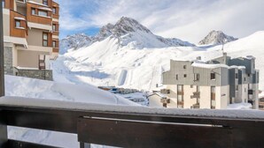 A snow-covered mountain landscape with modern buildings in the foreground. - Plein Soleil (Val Claret) by Interhome (Tignes)