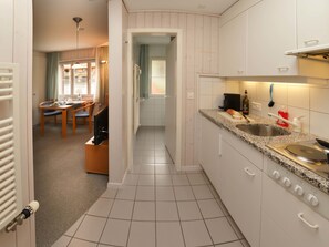 Fridge, cookware/dishes/utensils, dining tables - Suzanne Nr. 21 by Interhome (Schönried)