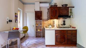 Fridge, microwave, highchair, cookware/dishes/utensils