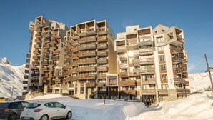 A multi-story hotel with balconies and a snowy landscape. - Le Slalom (Val Claret) by Interhome (Tignes)
