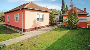 A residential area with two houses, one with a red facade and another with a white facade. - Apricot by Interhome (Balatonfenyves)