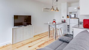 A modern apartment with a living room, a kitchen, and a dining area. - la Pergola by Interhome (Hossegor)