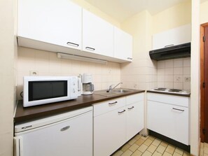 Fridge, highchair, cookware/dishes/utensils