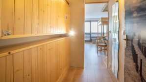 A wooden hallway with a view to a balcony area. - Le Slalom (Val Claret) by Interhome (Tignes)