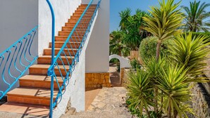 A staircase with blue railings leading up to a white building. - Vacation home Luisa by Interhome (Calpe/Calp)