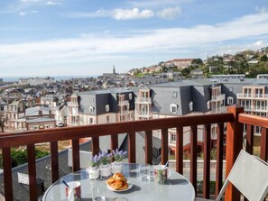 Enjoy a meal on the balcony with a view of the city's diverse architecture.