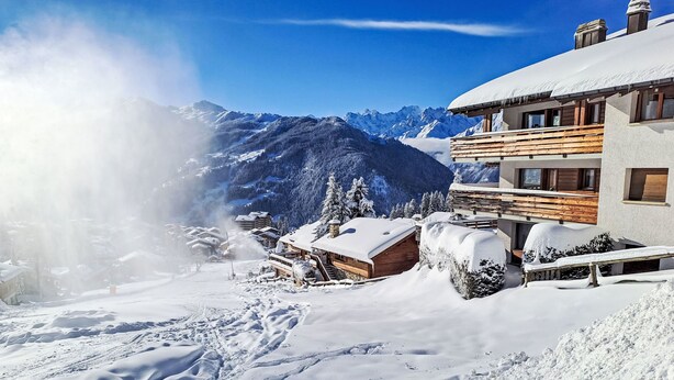 A snow-covered mountain resort with wooden buildings and a clear sky. - Eldorado 321 by Interhome (Verbier)