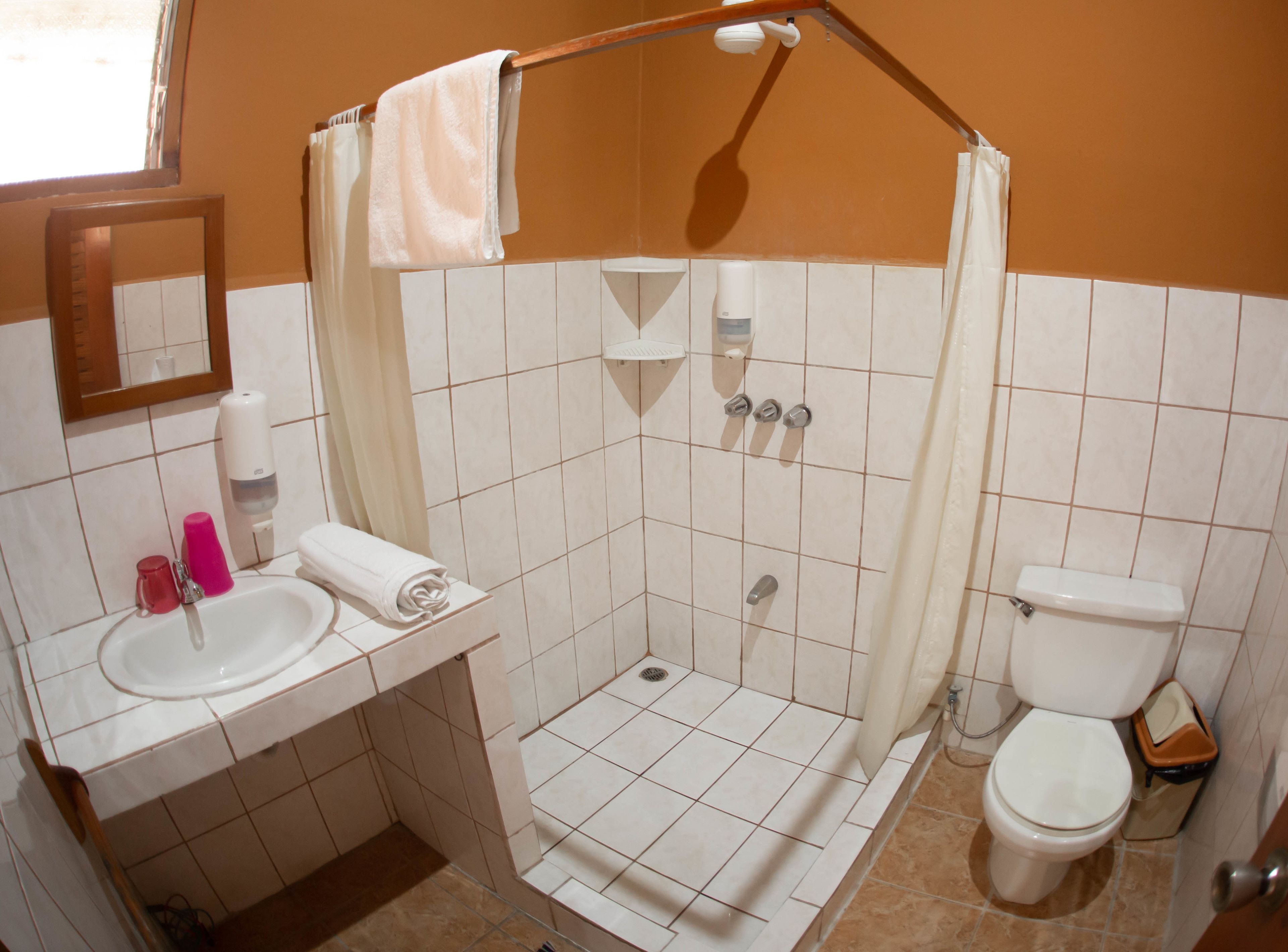 shower, rainfall showerhead, hair dryer, towels