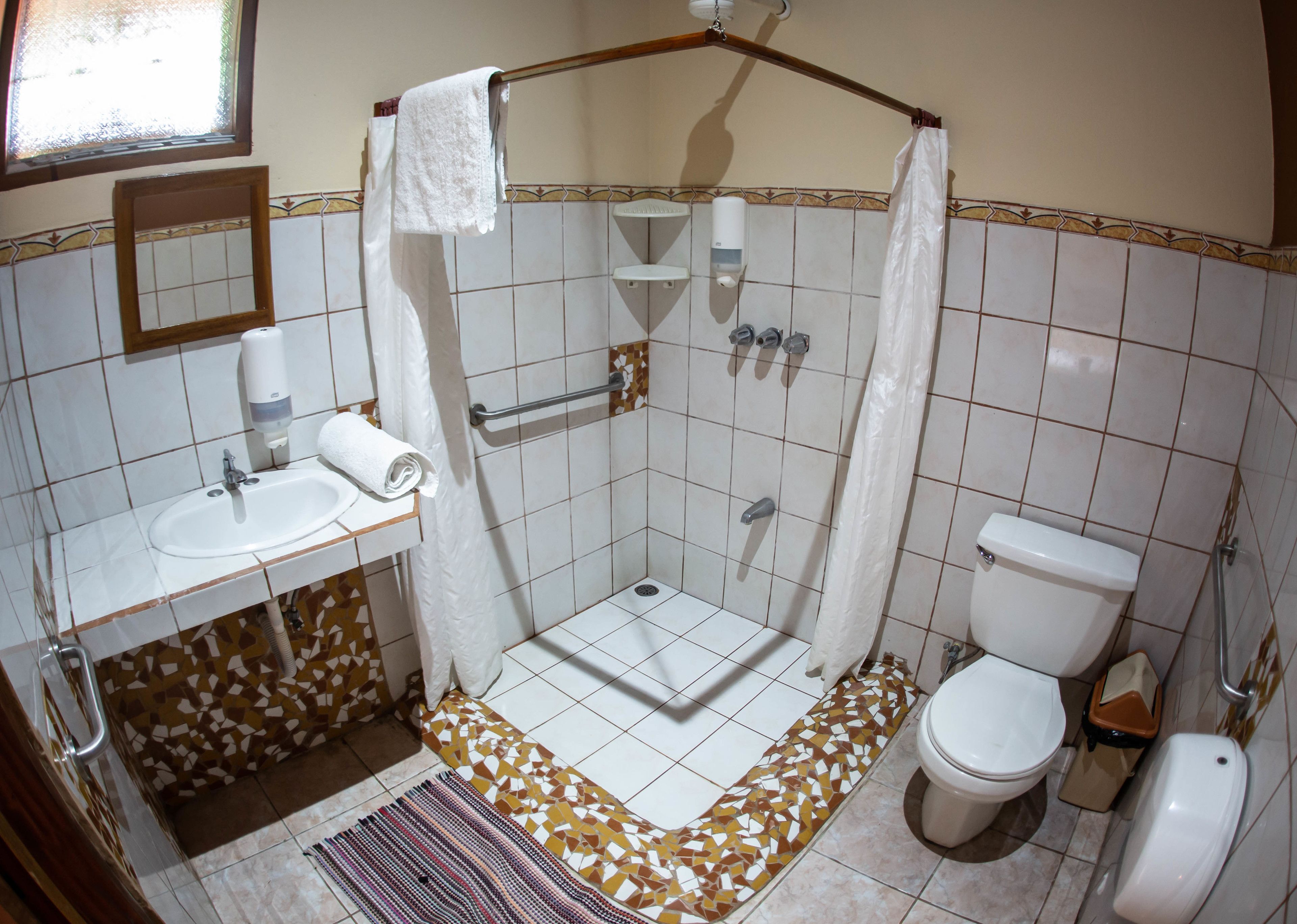 shower, rainfall showerhead, hair dryer, towels