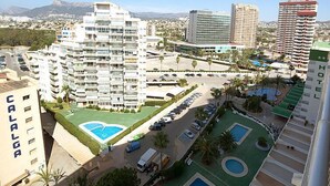 A hotel complex with multiple buildings, a swimming pool, and a parking area. - Esmeralda 02 by Interhome (Calpe/Calp)