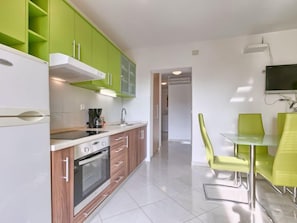 Fridge, microwave, cookware/dishes/utensils