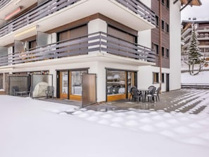 Enjoy a relaxing moment on the balcony with a view, surrounded by comfortable seating and a table.