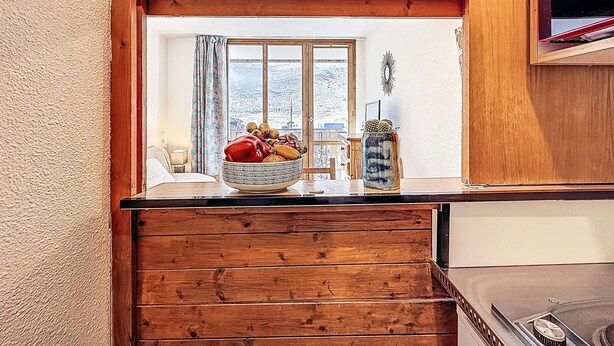 A wooden-framed window with a view of a snowy landscape. - Rond Point des Pistes (Val Claret) by Interhome (Tignes)