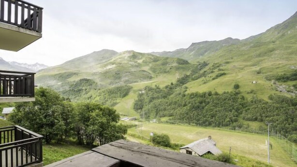 A balcony with a view of a mountainous landscape. - Balcons d'Olympie 204 - A by Interhome (Les Menuires)