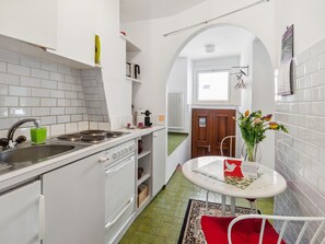 Fridge, oven, high chair, cookware/dishes/utensils